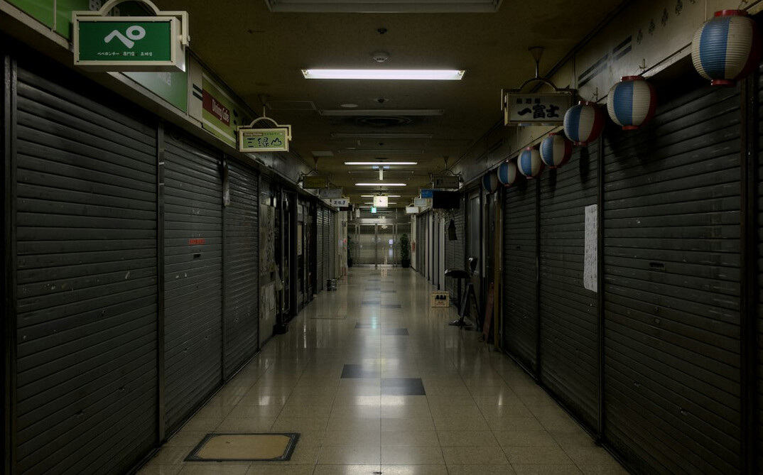 security guard patrolling empty mall at night