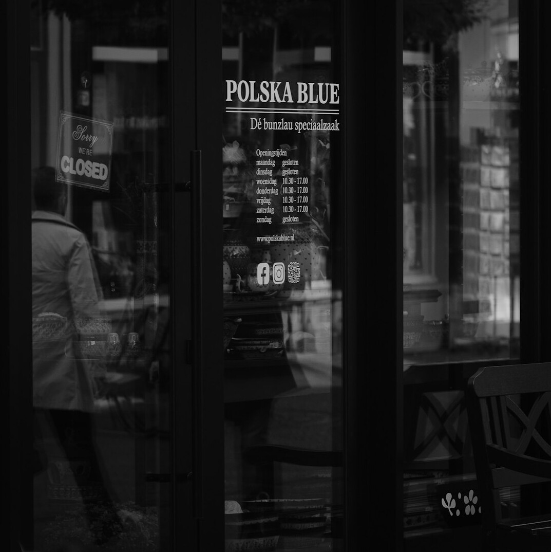 security guard checking store door at night